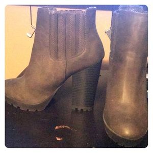 High heeled dark gray booties in new condition.
